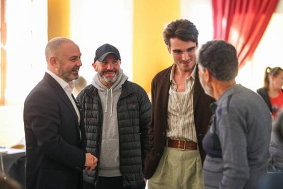 Film Commissioner Johann Grech together with Minister Owen Bonnici and actor Corey Mylchreest during a visit to the set of The Travel Writer, meeting members of the production crew.
